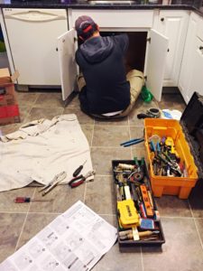 plumber fixing a sink